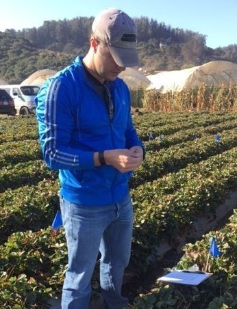 Biology student conducting research in an agriculture field